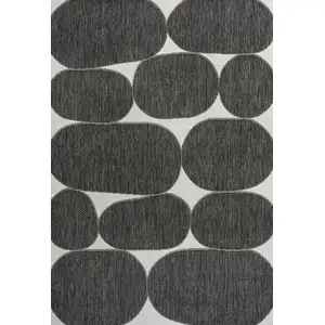 Photo of Black And Cream Geometric Indoor Outdoor Area Rug