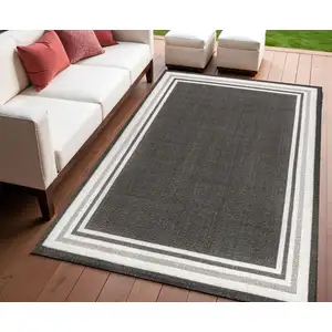 Photo of Black And Cream Striped Indoor Outdoor Area Rug