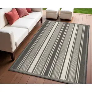 Photo of Black And Cream Striped Indoor Outdoor Area Rug