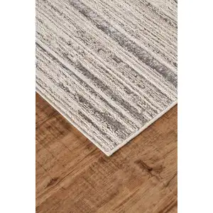 Photo of Black And Dark Gray Abstract Stain Resistant Area Rug