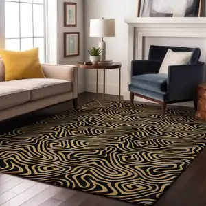 Photo of Black And Gold Abstract Washable Area Rug With UV Protection
