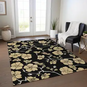 Photo of Black And Gold Floral Washable Indoor Outdoor Area Rug
