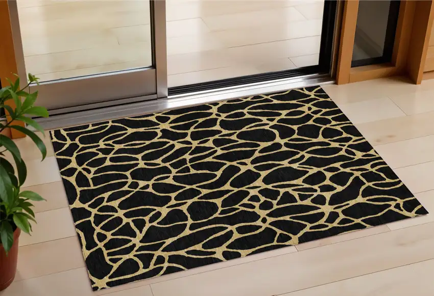 Black And Gold Geometric Washable Indoor Outdoor Area Rug Photo 1