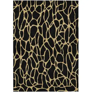 Photo of Black And Gold Geometric Washable Indoor Outdoor Area Rug