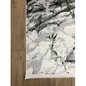 Photo of Black And Gray Abstract Area Rug With Fringe