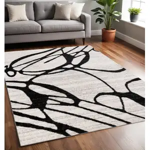 Photo of Black And Gray Abstract Area Rug