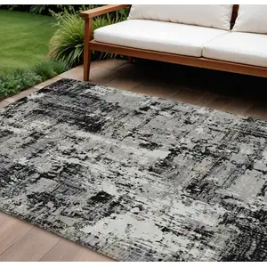Photo of Black And Gray Abstract Washable Indoor Outdoor Area Rug