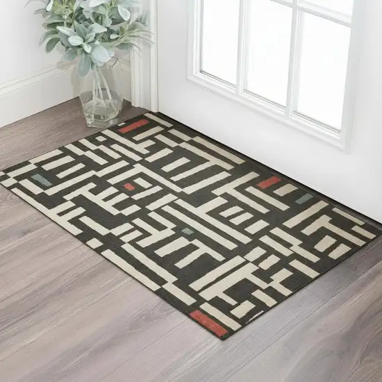 Black And Ivory Abstract Area Rug Photo 1