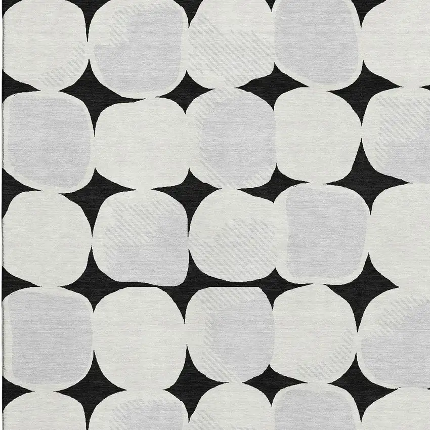 Black And Ivory Abstract Geometric Washable Area Rug With UV Protection Photo 3
