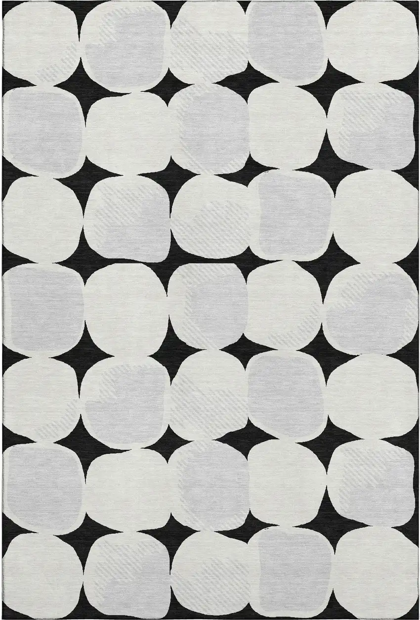 Black And Ivory Abstract Geometric Washable Area Rug With UV Protection Photo 1
