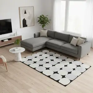 Photo of Black And Ivory Abstract Geometric Washable Area Rug With UV Protection