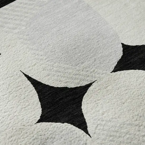Black And Ivory Abstract Geometric Washable Area Rug With UV Protection Photo 9
