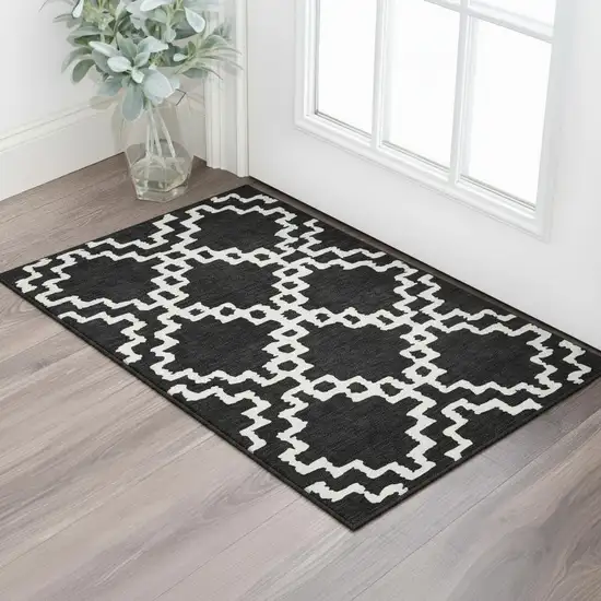 Black And Ivory Abstract Geometric Washable Area Rug With UV Protection Photo 2