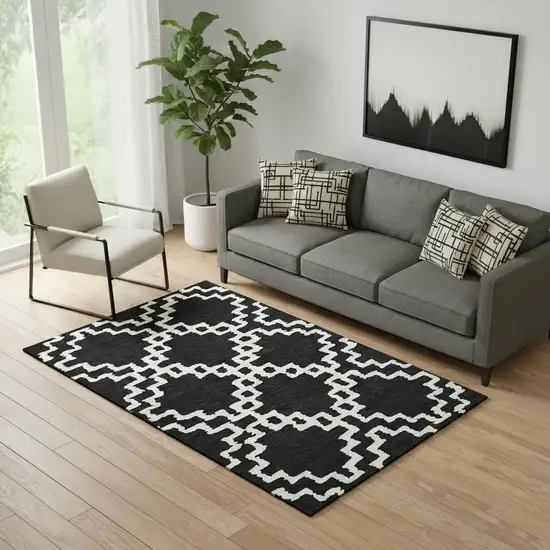 Black And Ivory Abstract Geometric Washable Area Rug With UV Protection Photo 1