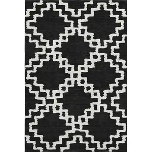 Photo of Black And Ivory Abstract Geometric Washable Area Rug With UV Protection