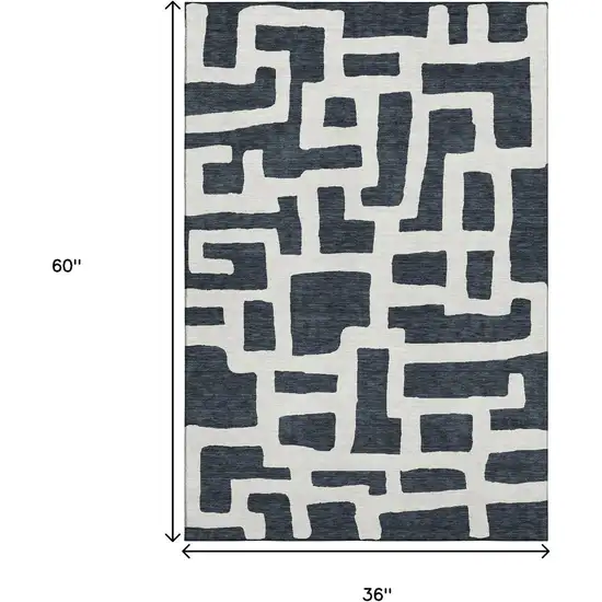 Black And Ivory Abstract Geometric Washable Area Rug With UV Protection Photo 3