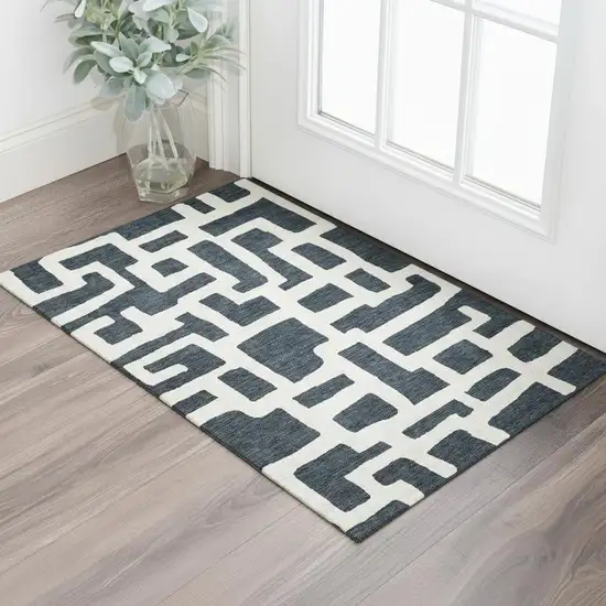 Black And Ivory Abstract Geometric Washable Area Rug With UV Protection Photo 1