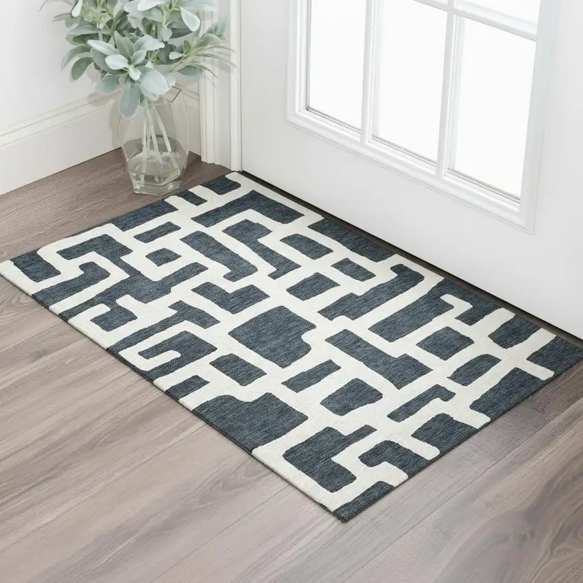 Black And Ivory Abstract Geometric Washable Area Rug With UV Protection Photo 1