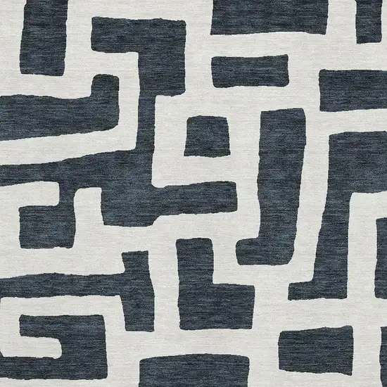 Black And Ivory Abstract Geometric Washable Area Rug With UV Protection Photo 3