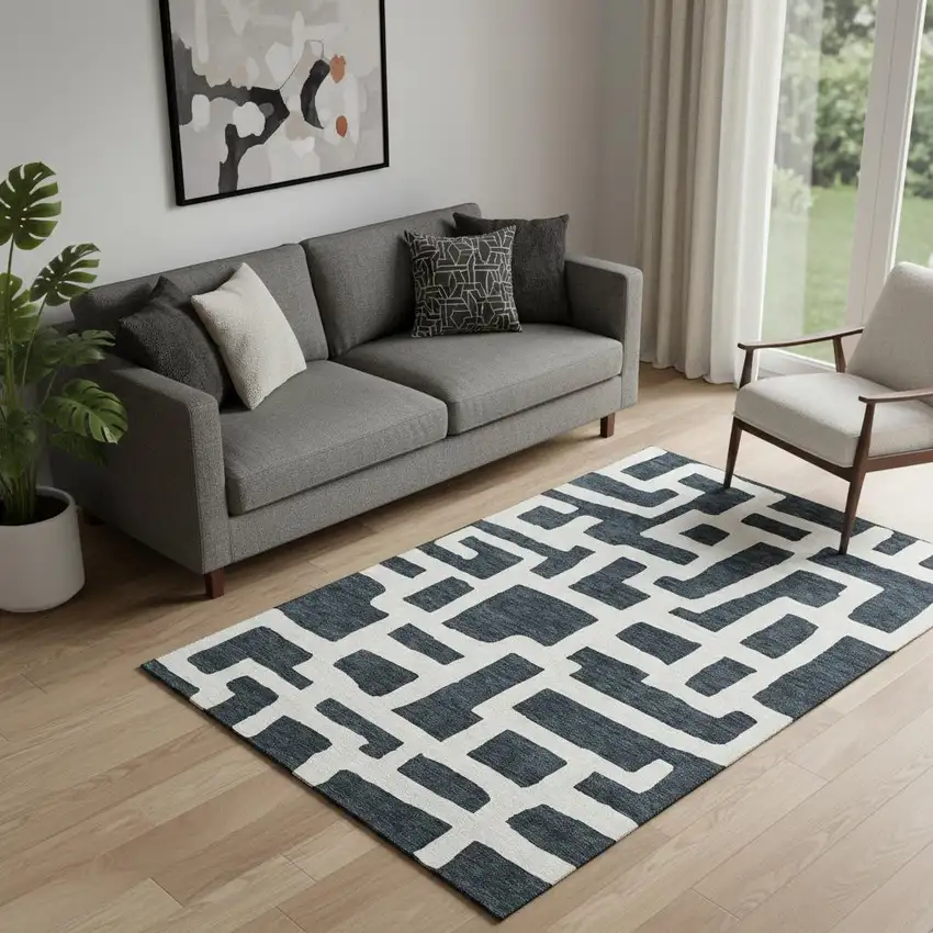 Black And Ivory Abstract Geometric Washable Area Rug With UV Protection Photo 1