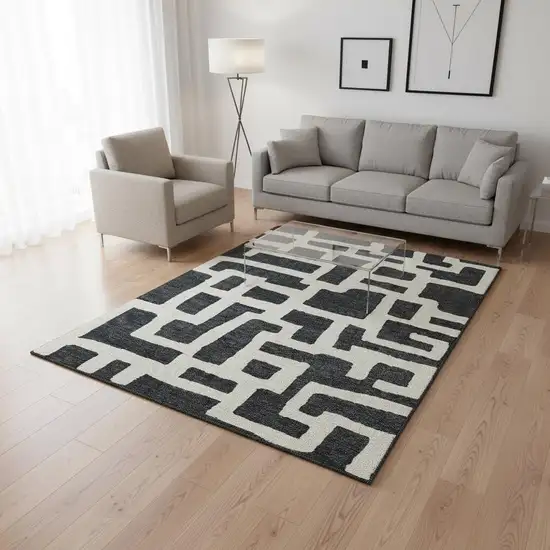 Black And Ivory Abstract Geometric Washable Area Rug With UV Protection Photo 2
