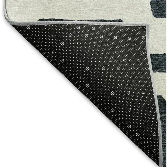 Black And Ivory Abstract Geometric Washable Area Rug With UV Protection Photo 6