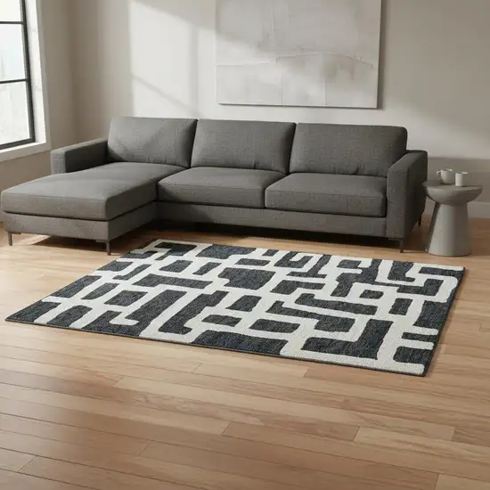 Black And Ivory Abstract Geometric Washable Area Rug With UV Protection Photo 2