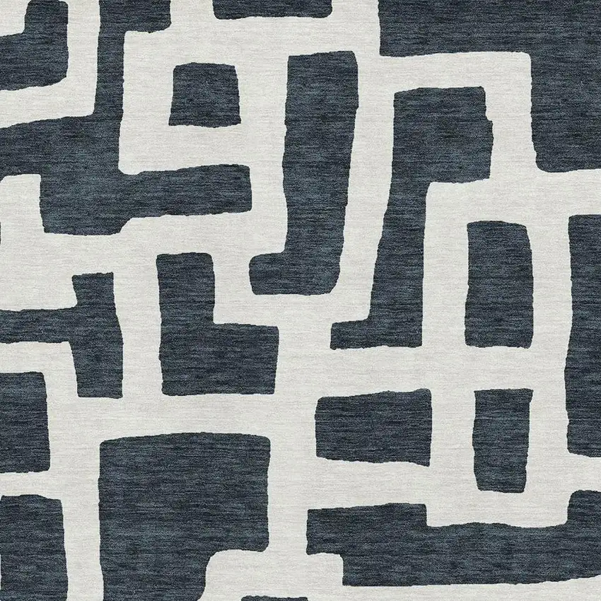 Black And Ivory Abstract Geometric Washable Area Rug With UV Protection Photo 3