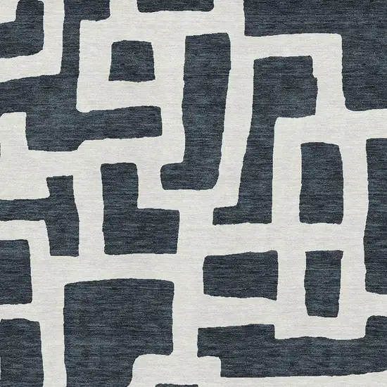 Black And Ivory Abstract Geometric Washable Area Rug With UV Protection Photo 3