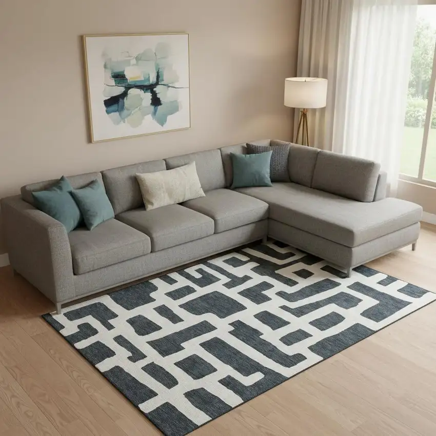 Black And Ivory Abstract Geometric Washable Area Rug With UV Protection Photo 1