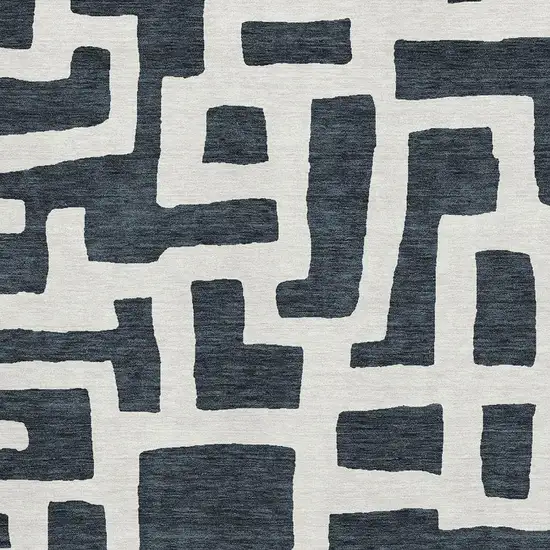 Black And Ivory Abstract Geometric Washable Area Rug With UV Protection Photo 3