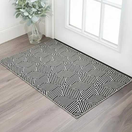 Black And Ivory Abstract Geometric Washable Area Rug With UV Protection Photo 2