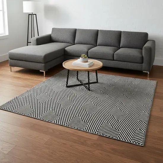 Black And Ivory Abstract Geometric Washable Area Rug With UV Protection Photo 2