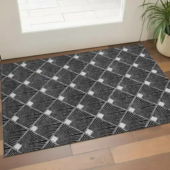 Black And Ivory Abstract Geometric Washable Area Rug With UV Protection Photo 1
