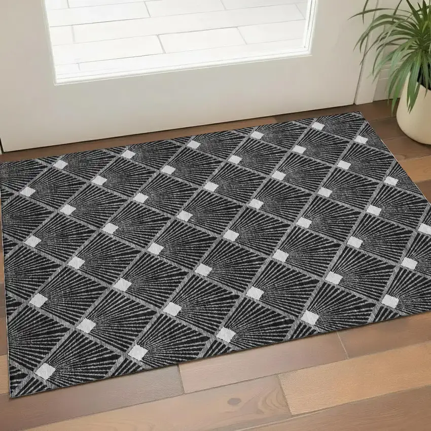 Black And Ivory Abstract Geometric Washable Area Rug With UV Protection Photo 1