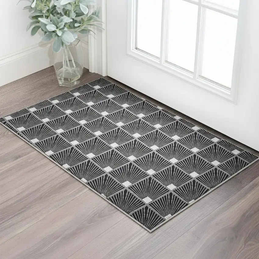Black And Ivory Abstract Geometric Washable Area Rug With UV Protection Photo 2