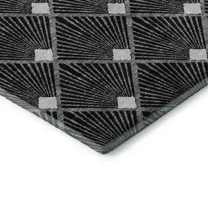 Photo of Black And Ivory Abstract Geometric Washable Area Rug With UV Protection