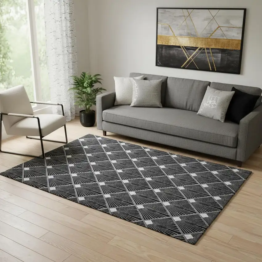 Black And Ivory Abstract Geometric Washable Area Rug With UV Protection Photo 1