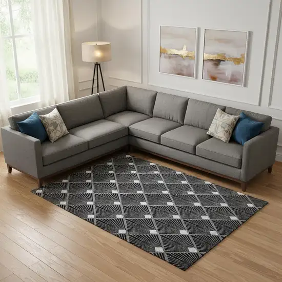 Black And Ivory Abstract Geometric Washable Area Rug With UV Protection Photo 1