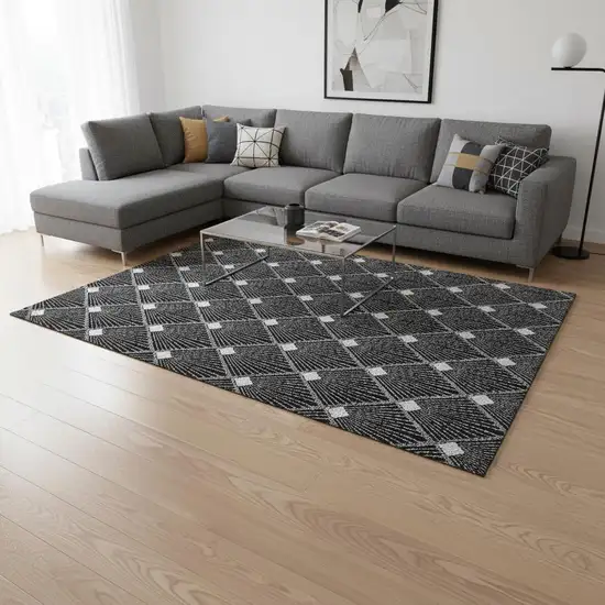 Black And Ivory Abstract Geometric Washable Area Rug With UV Protection Photo 2