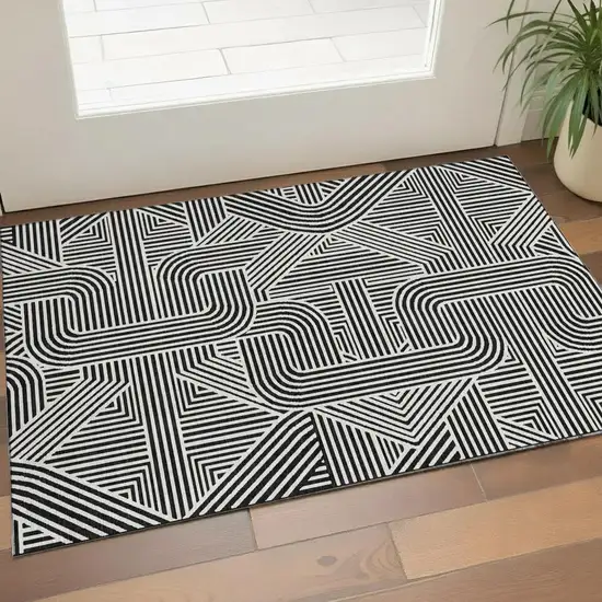 Black And Ivory Abstract Geometric Washable Area Rug With UV Protection Photo 1