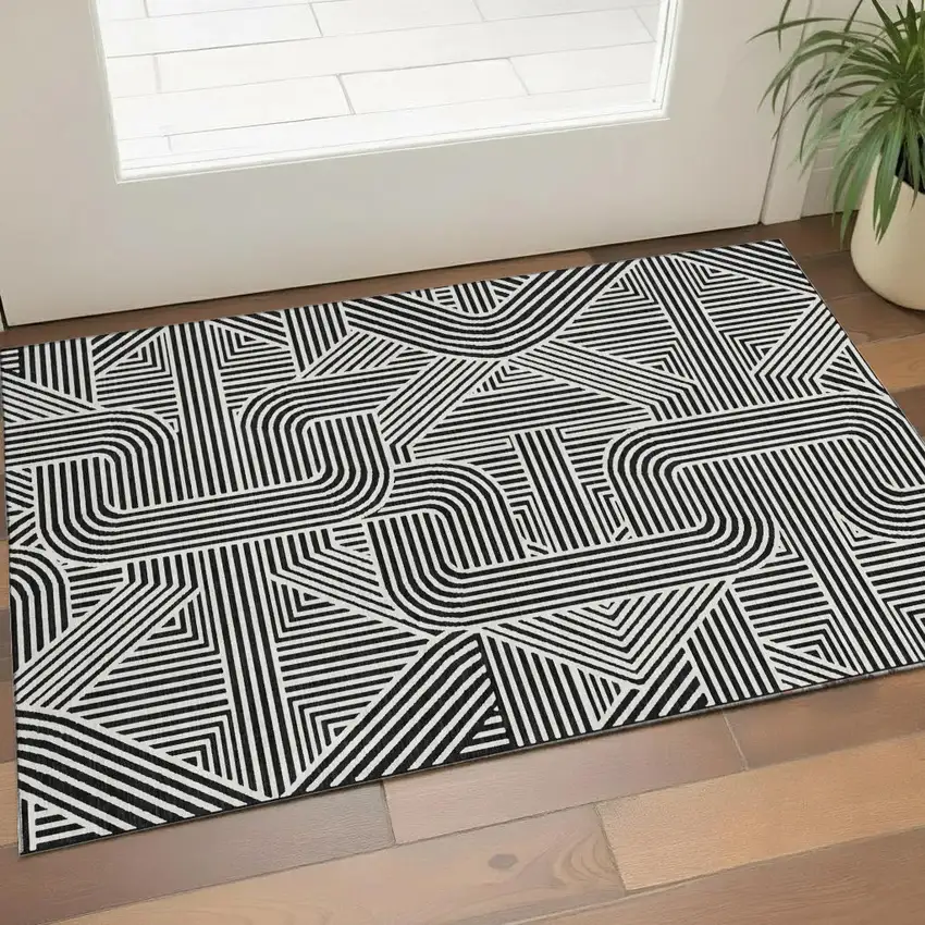 Black And Ivory Abstract Geometric Washable Area Rug With UV Protection Photo 1