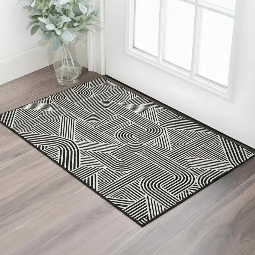 Black And Ivory Abstract Geometric Washable Area Rug With UV Protection Photo 2