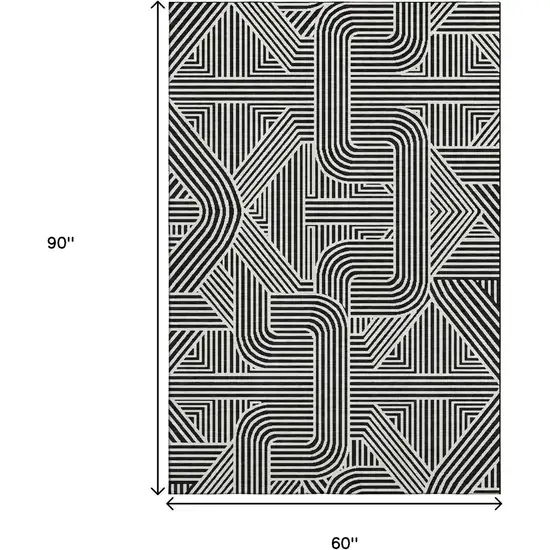 Black And Ivory Abstract Geometric Washable Area Rug With UV Protection Photo 3