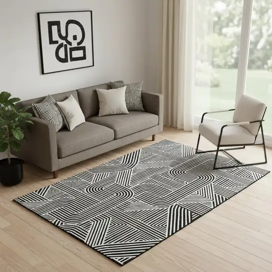 Black And Ivory Abstract Geometric Washable Area Rug With UV Protection Photo 1