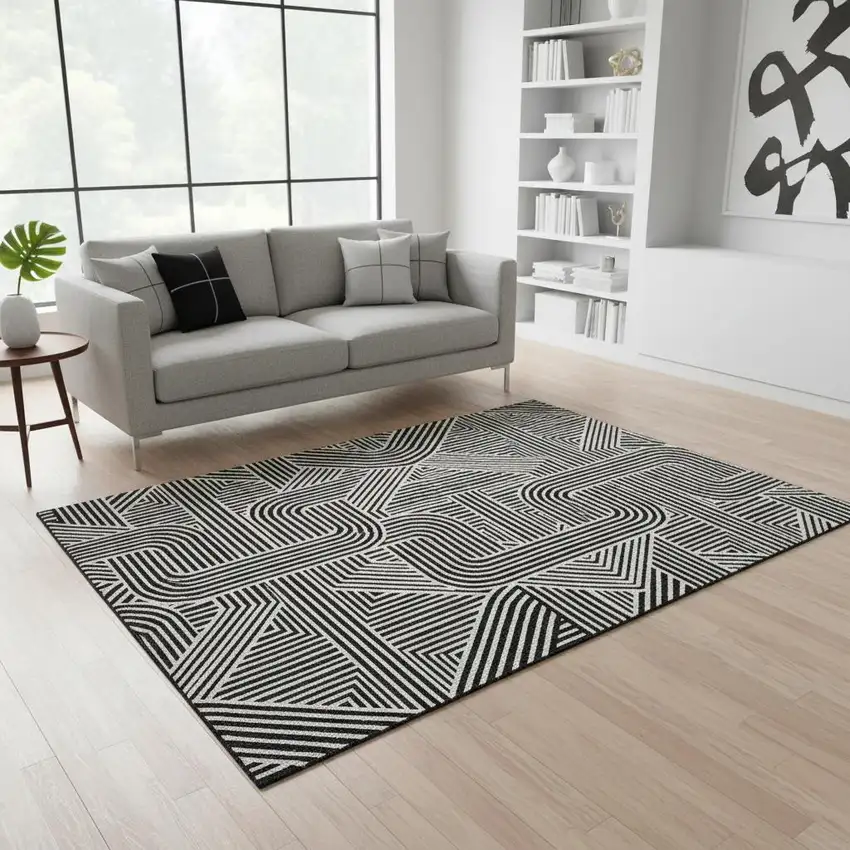 Black And Ivory Abstract Geometric Washable Area Rug With UV Protection Photo 2