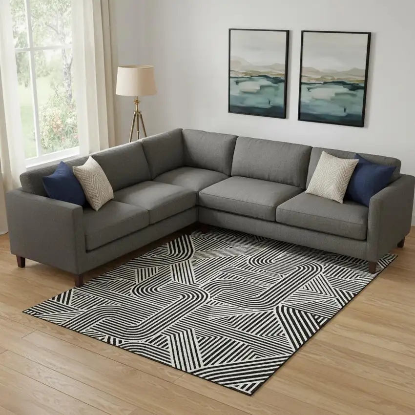 Black And Ivory Abstract Geometric Washable Area Rug With UV Protection Photo 1