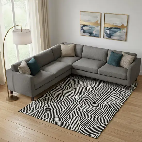 Black And Ivory Abstract Geometric Washable Area Rug With UV Protection Photo 1