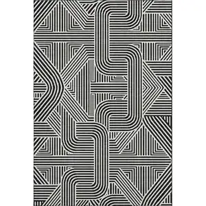 Photo of Black And Ivory Abstract Geometric Washable Area Rug With UV Protection