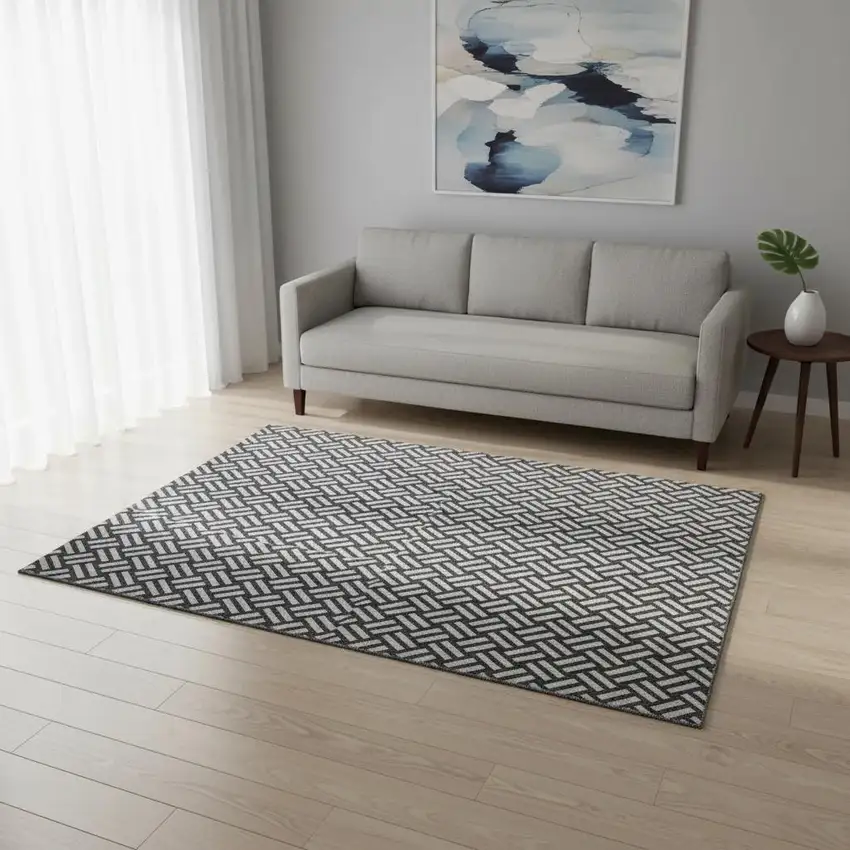 Black And Ivory Abstract Geometric Washable Area Rug With UV Protection Photo 2